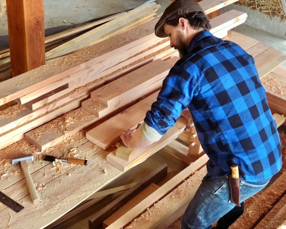 Craftsman Supply Co owner Austin working on his house with tools that are sold in the store.