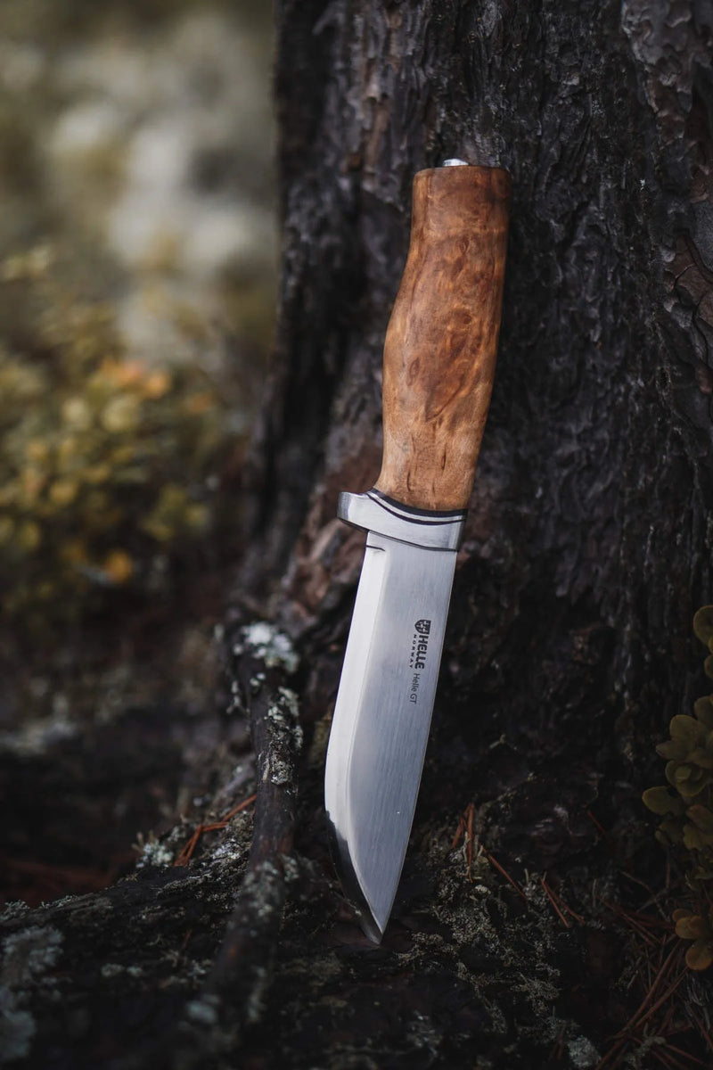 Helle GT 14C28N Knife against tree - Craftsman Supply Co