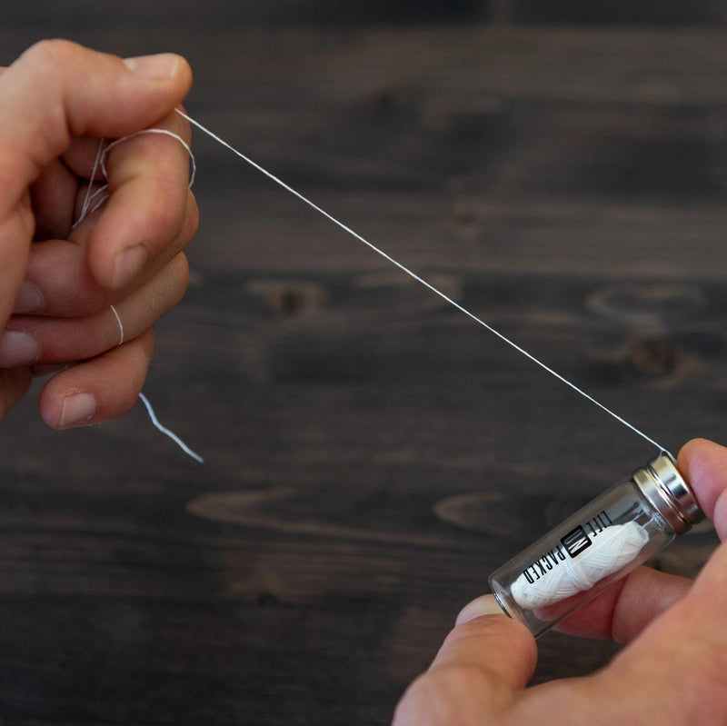 Man using Plastic free dental floss