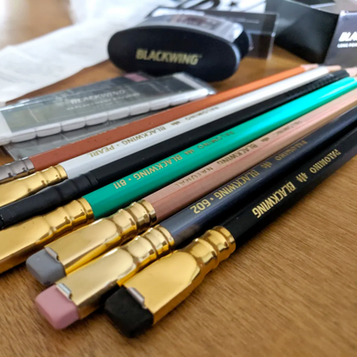A bunch of Blackwing pencils and its pencil sharpener. | Craftsman Supply Co. 